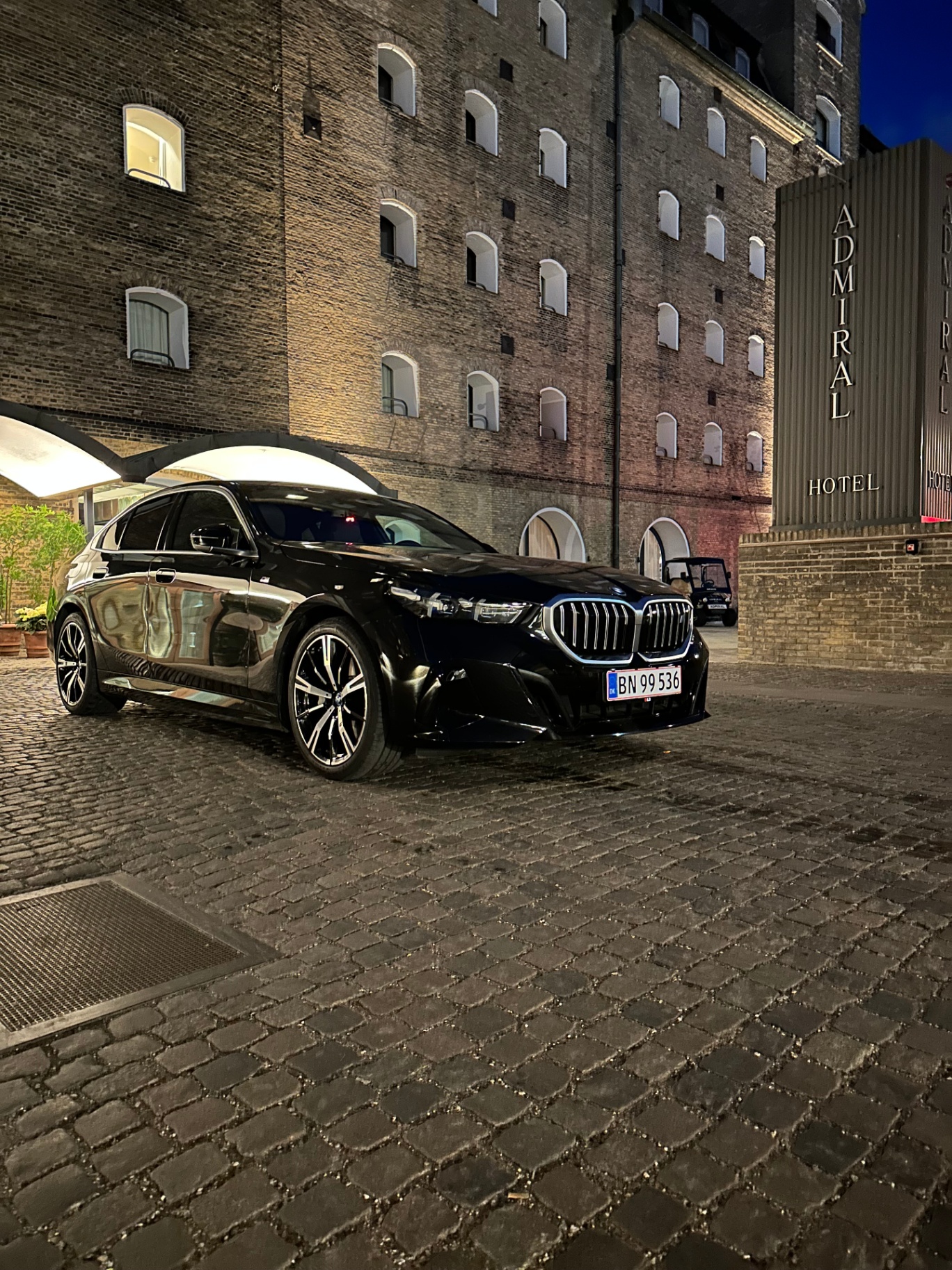 Prime Limousine BMW i5 outside Admiral Hotel in Copenhagen