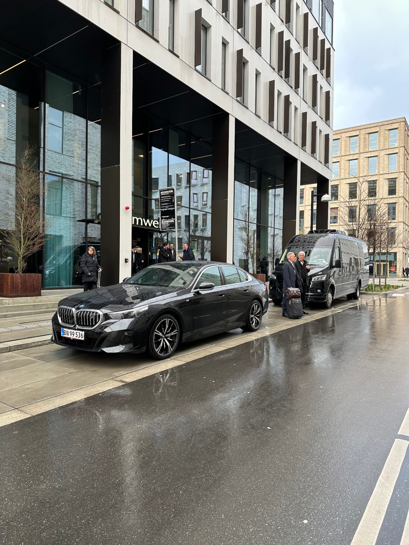 Prime Limousine BMW i5 positioned outside a premium hotel in Copenhagen